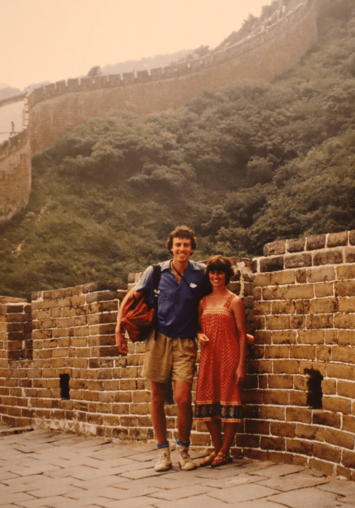 An older photo of Brock and Sue standing on the Great Wall of China. 