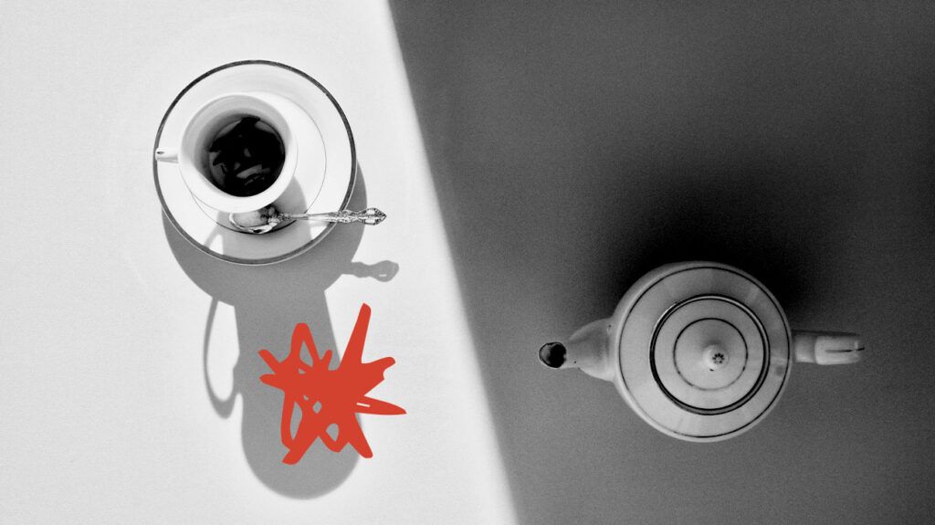 black and white photo of coffee pot and coffee cup seen from above