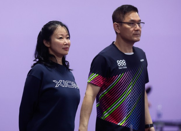 Huifen Chan, left, founder and president of 888 Table Tennis, stands next to JiHyun Park, director of coaching program at 888 Table Tennis, during a practice at 888 Table Tennis in Burlingame, Calif., on Thursday, June 20, 2024. (Nhat V. Meyer/Bay Area News Group)