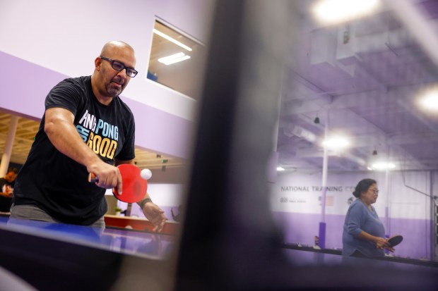 Vikas Chinnan, of San Carlos, participates in a Parkinson’s table...