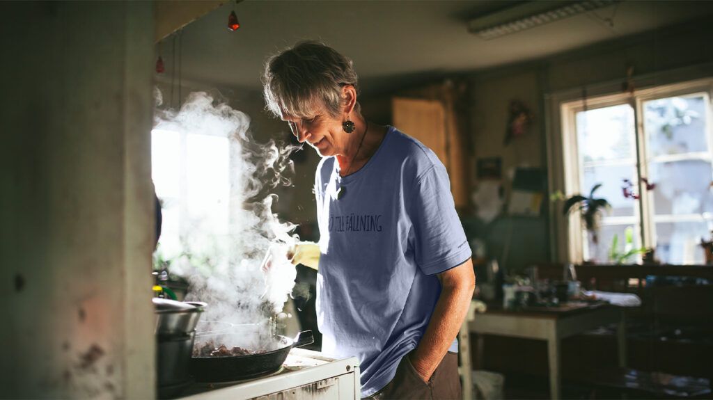 woman steaming food in pan