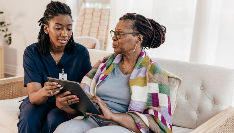 Photograph of a healthcare practitioner and a patient to represent personalised care