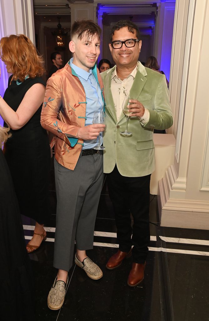 Two men posing for photo