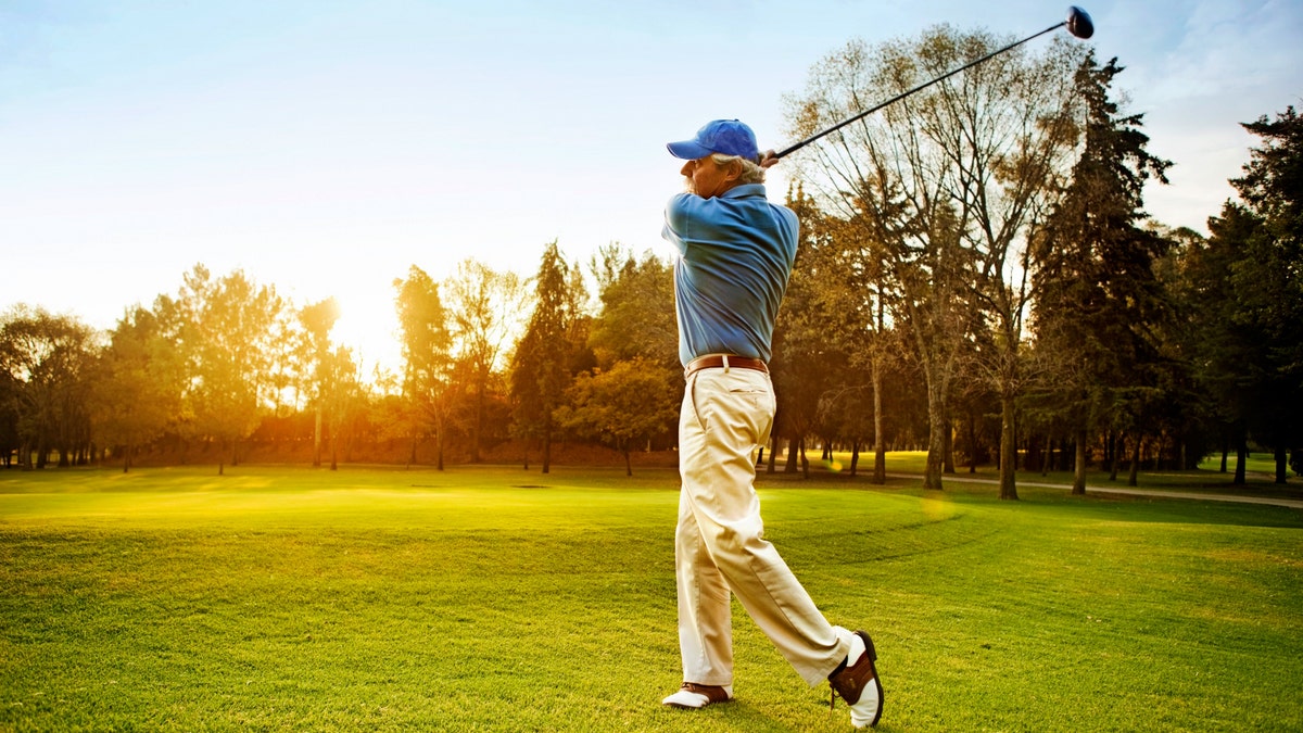 Man swinging golf club