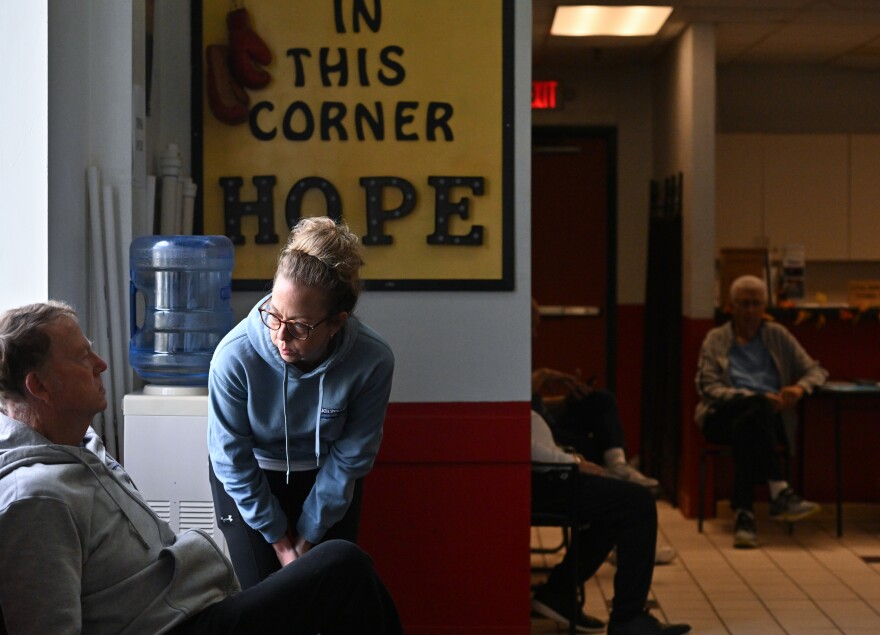Kristy Karluk and her father Bill West talk during a Rock Steady Boxing class in Old Forge.