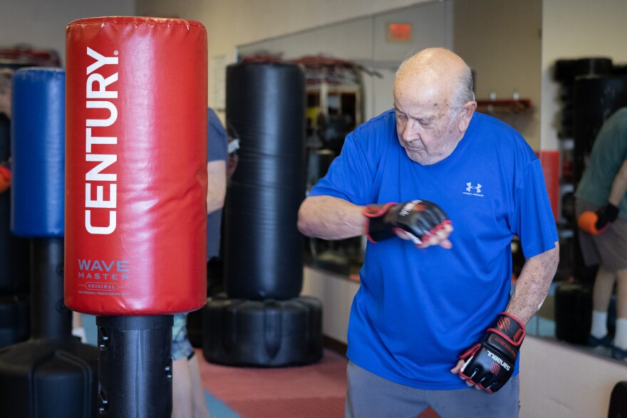 Jerry Haramillo hits the punching bag with the side of his arm during his class at More Than Boxing on Dec. 10, 2025