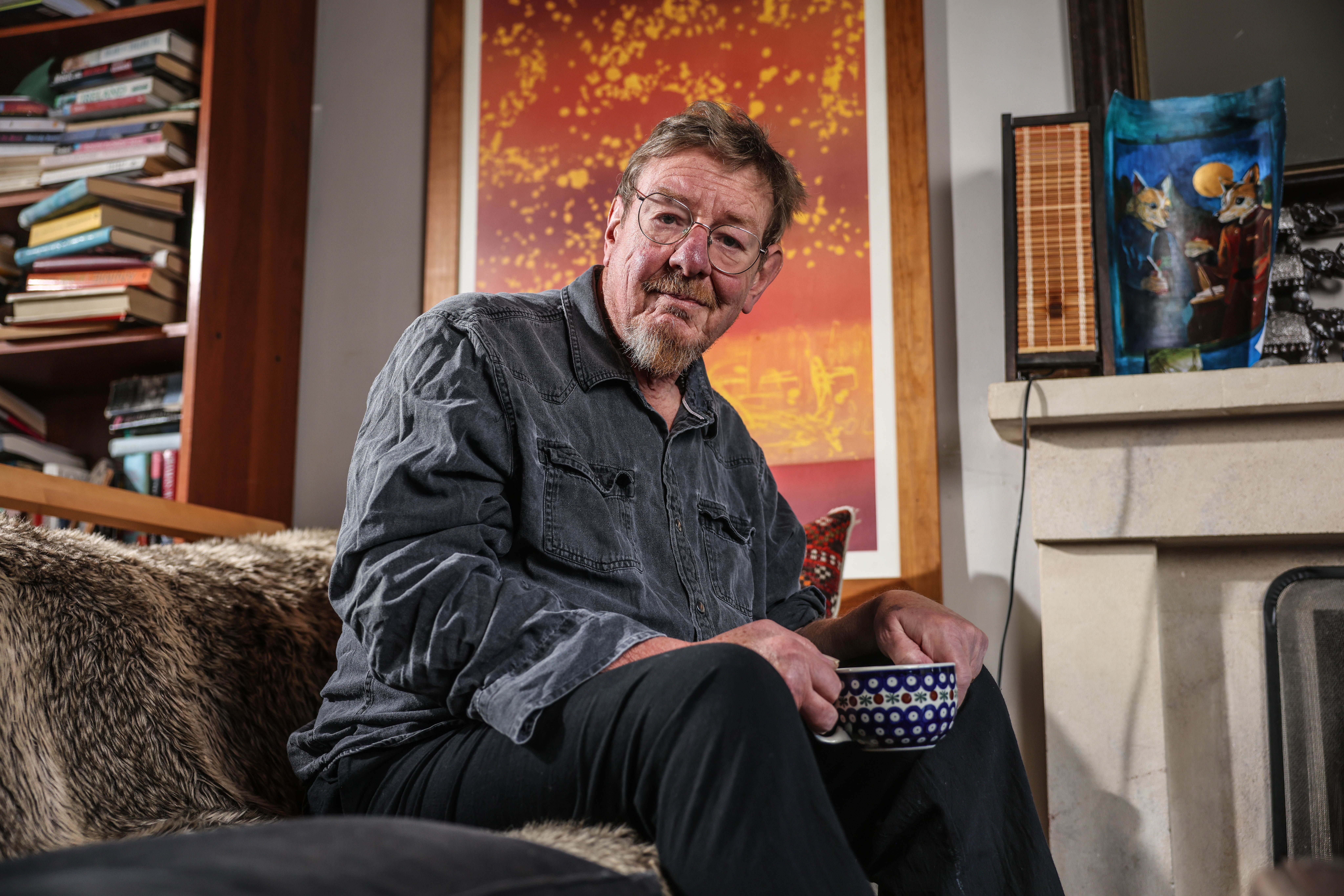 Mark Mardell sitting in his home with a patterned mug, looking at the camera.